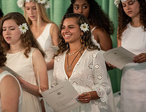 Photo of students on stage. Link to Gifts of Life Insurance