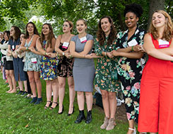 Photo of a group of younger people holding hands. Link to Life Stage Gift Planner Under Age 45 Situations.