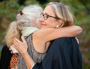 Photo of women hugging. Link to Gifts from Retirement Plans.